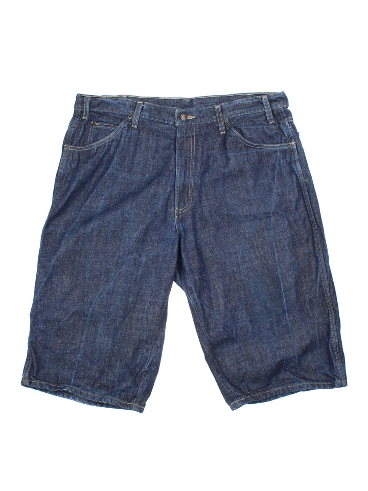 Vintage Dickies Denim Shorts in blue raw denim colourway with multiple pockets and the logo embroidered on the back.