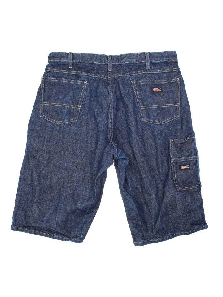 Vintage Dickies Denim Shorts in blue raw denim colourway with multiple pockets and the logo embroidered on the back.