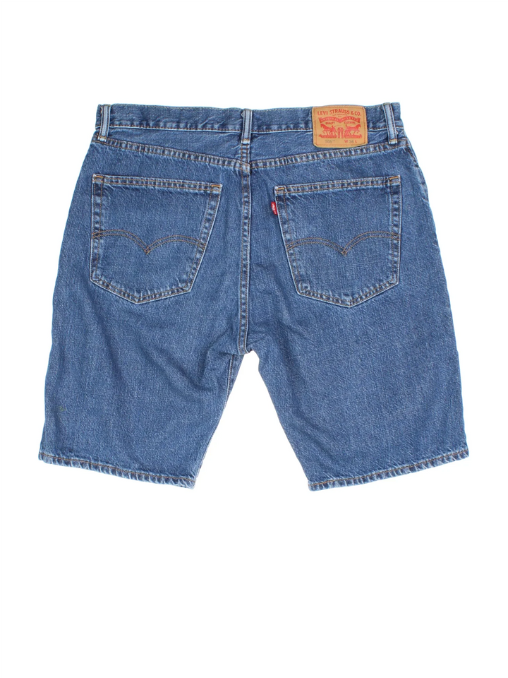 Vintage Levi Strauss Denim Shorts in blue colourway. Zip button fastening, multiple pockets and leather patch/tab branding on back.