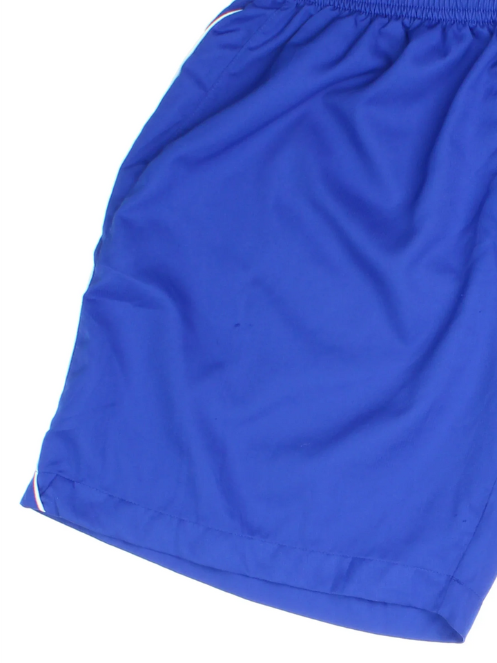 Vintage Umbro Sports Shorts in blue colourway with white trim. Drawstring waist and logo printed down side seams.