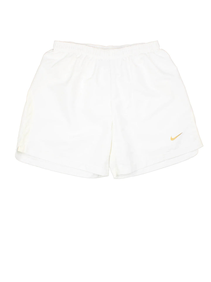 Vintage Nike Sports Shorts in white colourway with drawstring waist and logo printed on front.