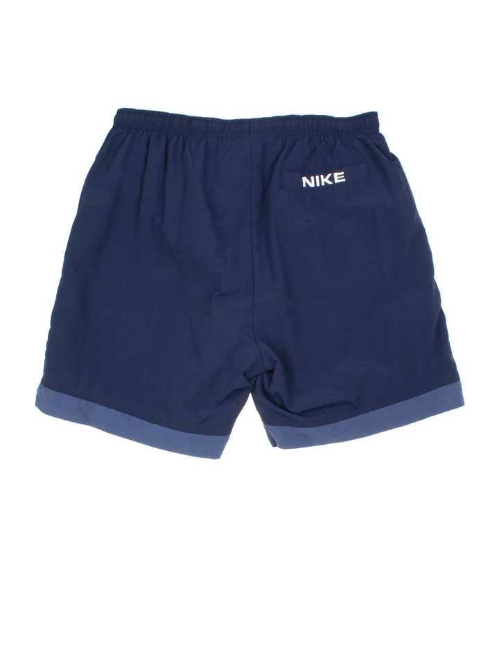 Vintage 90's Nike Sports Shorts in blue colourway with embroidered logo on the front.