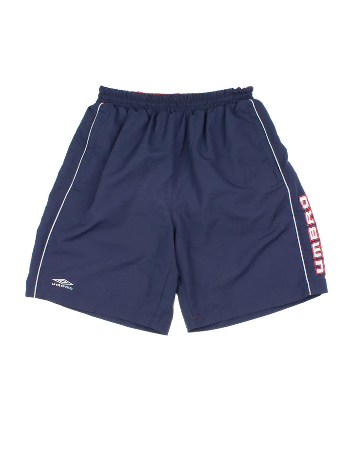 Vintage Umbro Swim Shorts in blue colourway with drawstring waist, contrast side branding and logo embroidered on front.