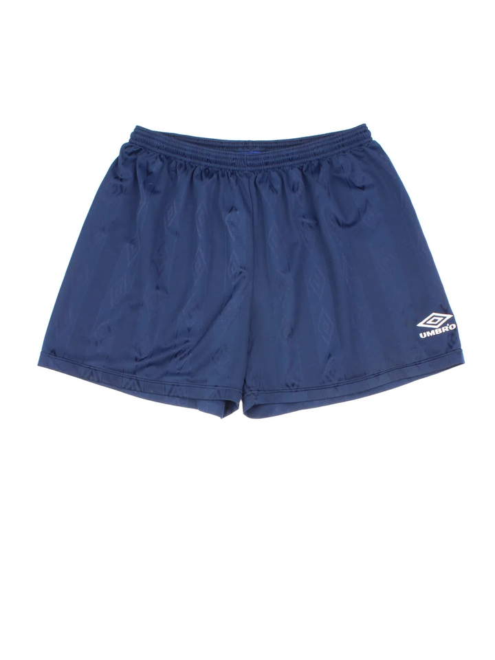 Vintage Umbro Shorts in blue colourway with drawstring waist and logo embroidered on front.