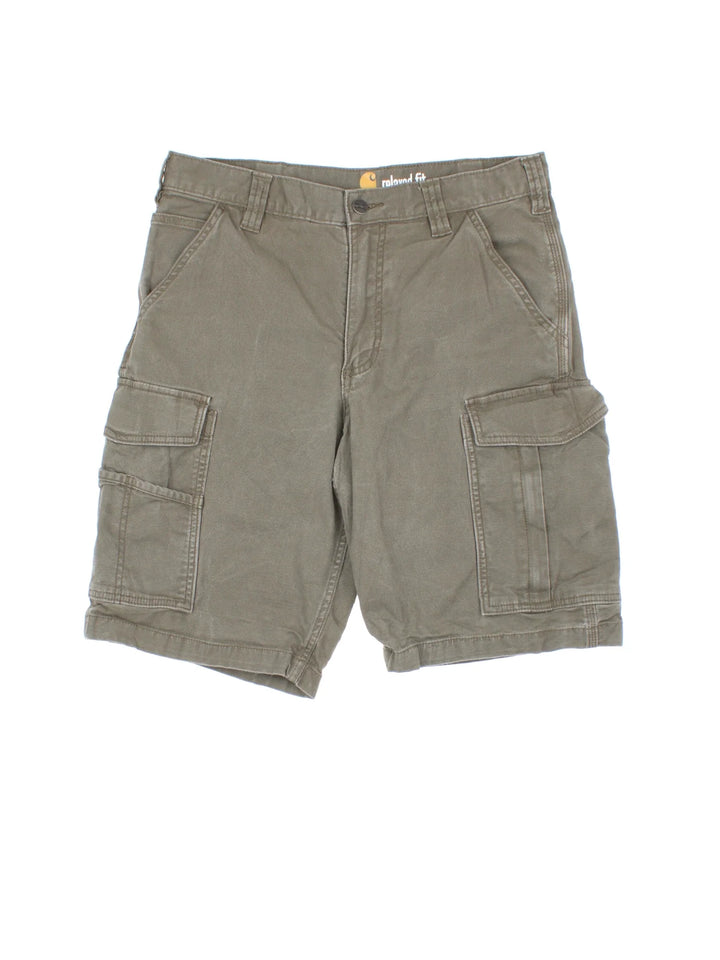 Vintage Carhartt Cargo Shorts in green colourway with multiple pockets and the logo embroidered on the back pocket.
