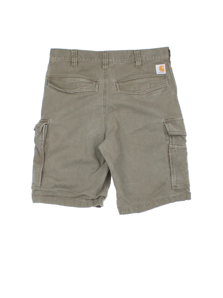 Vintage Carhartt Cargo Shorts in green colourway with multiple pockets and the logo embroidered on the back pocket.