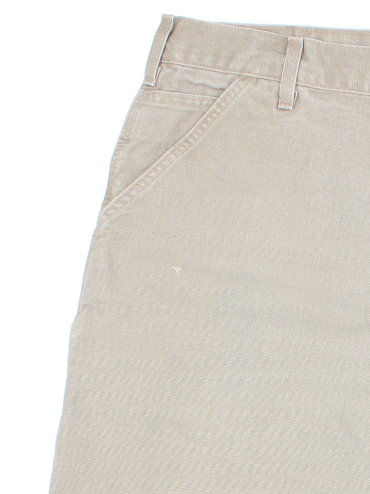 Vintage Carhartt Shorts in tan colourway. Zip/button fastening with multiple pockets and leather logo patch on back pocket.