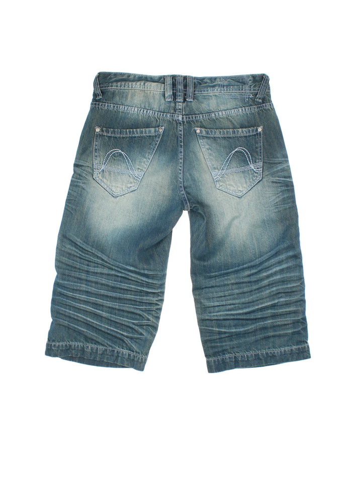 Vintage Y2K Denim Jorts in blue colourway. Zip fly fastening with multiple pockets and contrast stitching.
