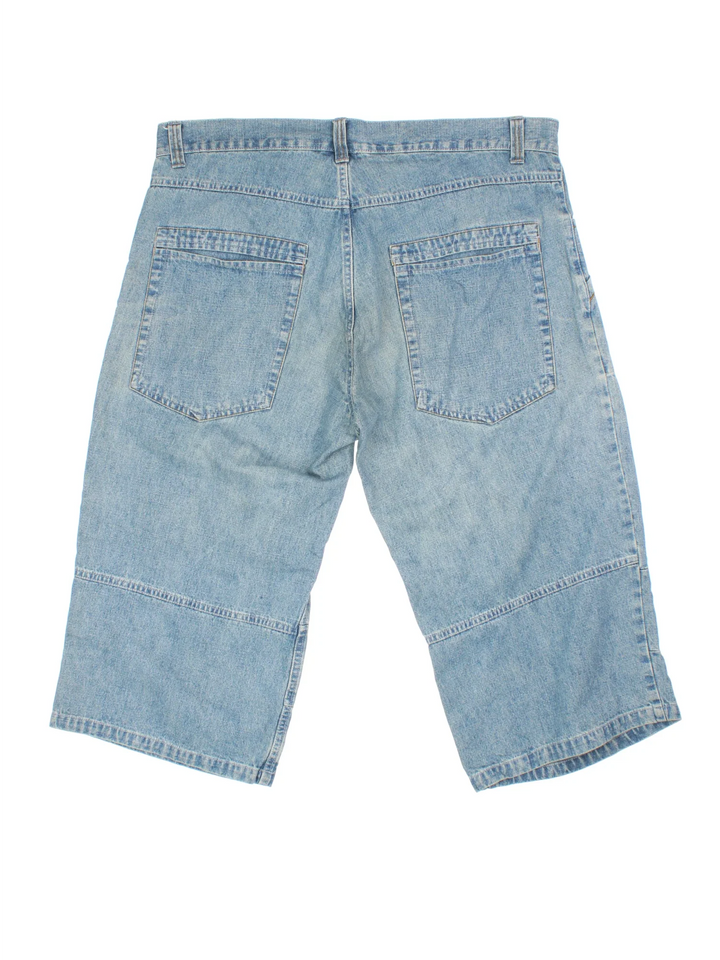 Vintage Y2K Denim Jorts in blue colourway. Zip fly fastening with multiple pockets and contrast stitching.