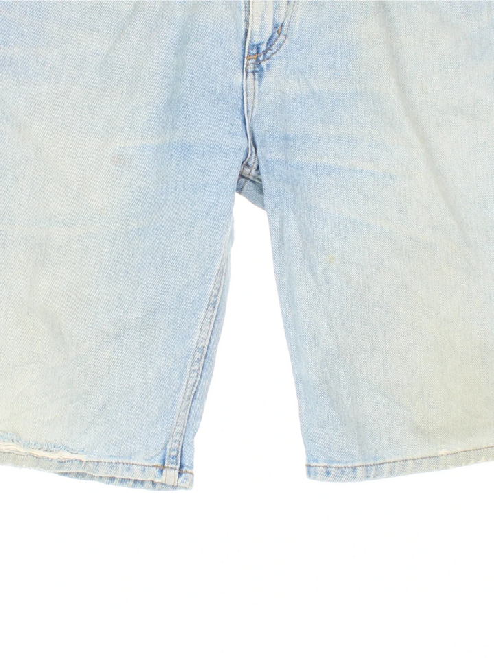 Vintage Carhartt Jorts in blue colourway with multiple pockets and the logo tab embroidered on the back.