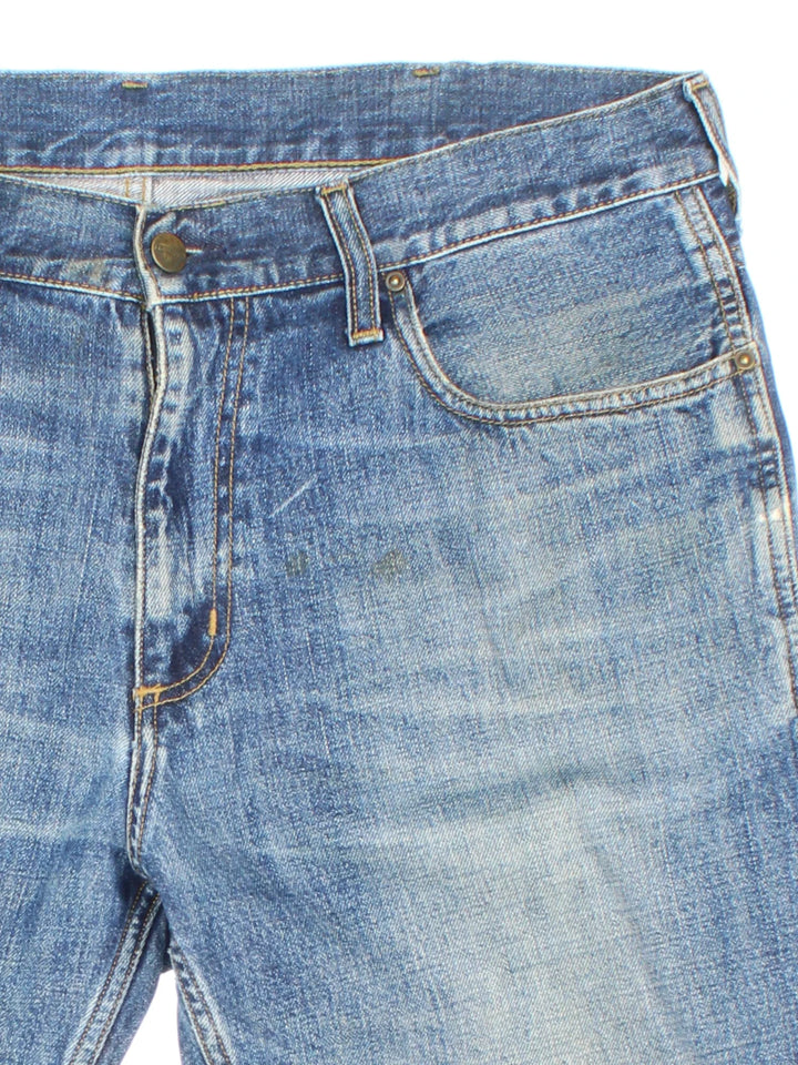 Vintage Carhartt Denim Shorts in blue colourway with multiple pockets and the logo embroidered on the back.