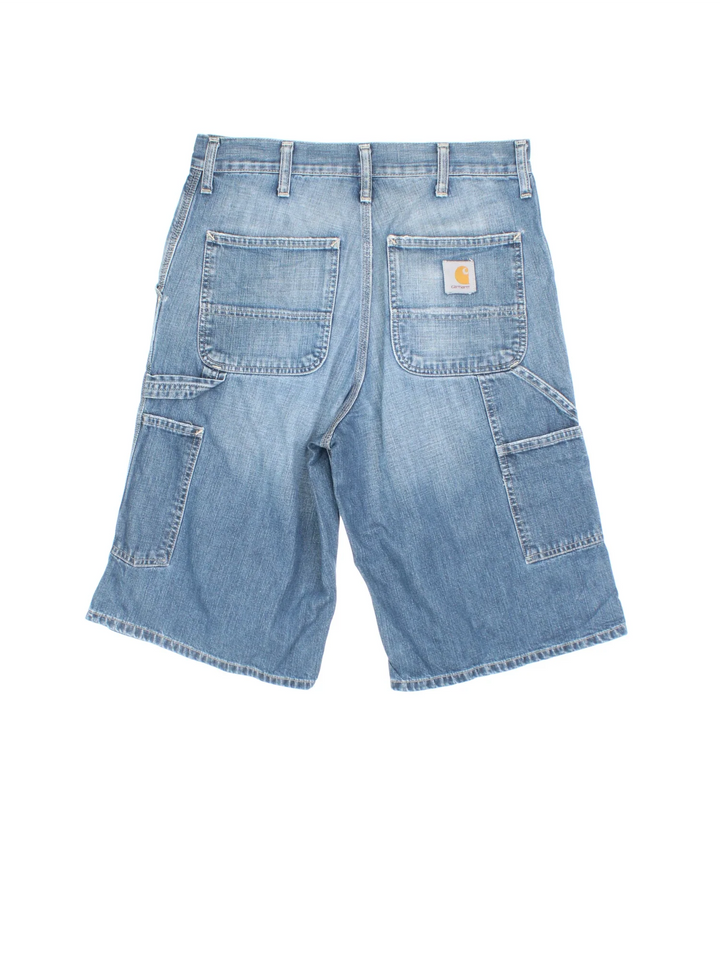 Vintage Carhartt Carpenter Shorts in blue colourway with multiple pockets and the logo embroidered on the back.