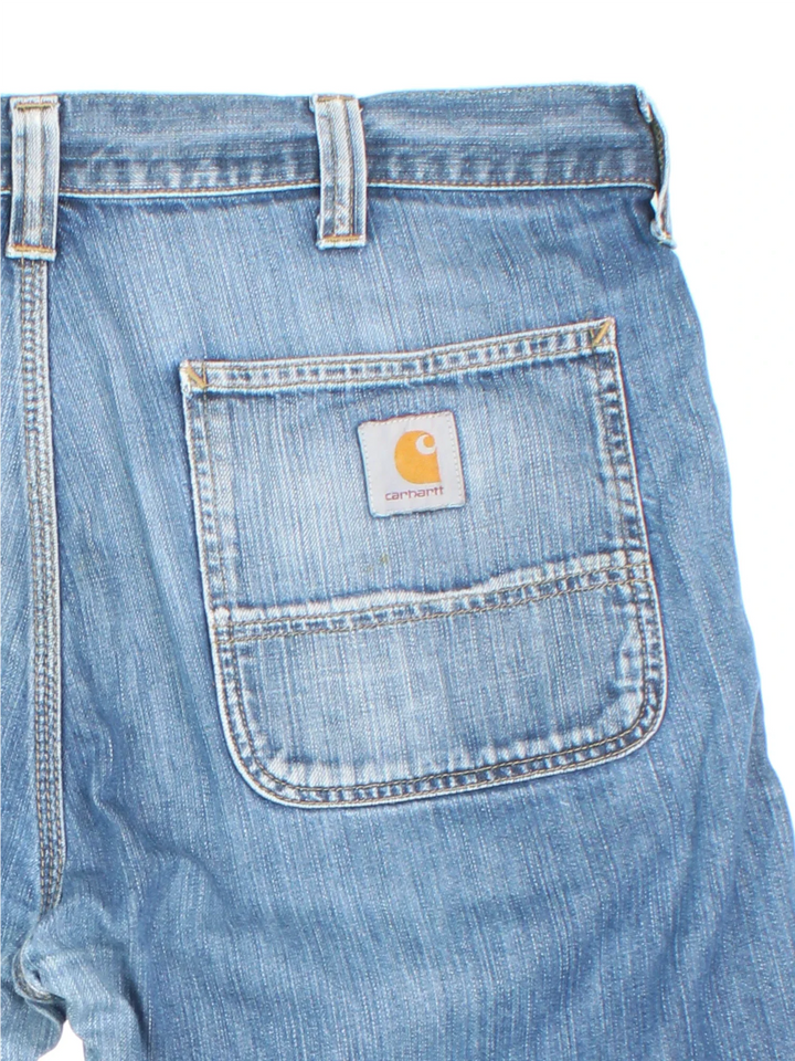 Vintage Carhartt Jorts in blue colourway with multiple pockets and the logo embroidered on the back.