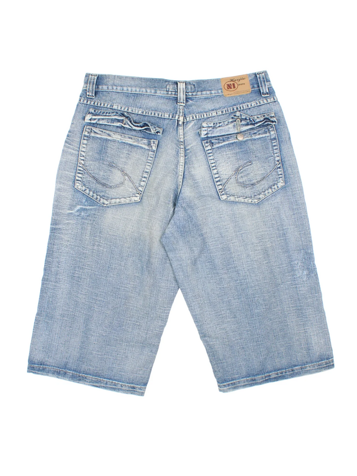 Vintage Y2K Denim Jorts in blue colourway with multiple pockets, contrast stitching and leather logo patch embroidered on the back.