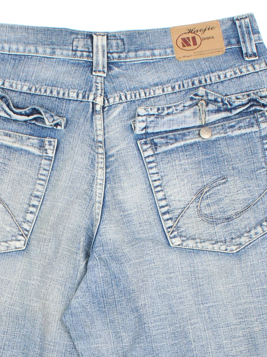 Vintage Y2K Denim Jorts in blue colourway with multiple pockets, contrast stitching and leather logo patch embroidered on the back.