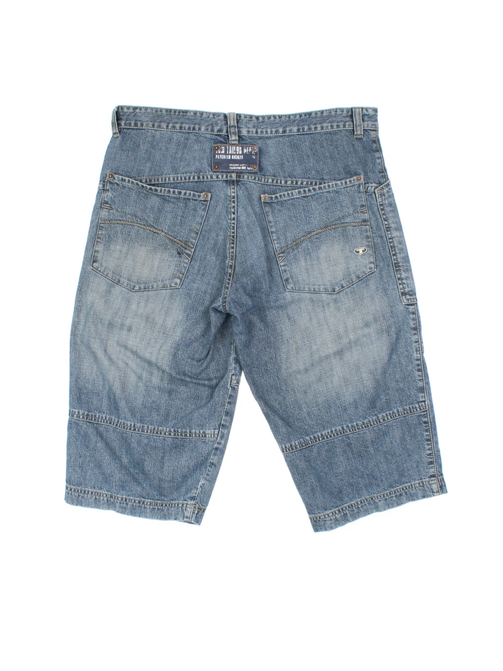 Vintage Y2K Denim Jorts in blue colourway with multiple pockets, contrast stitching and logo patch embroidered on the back.