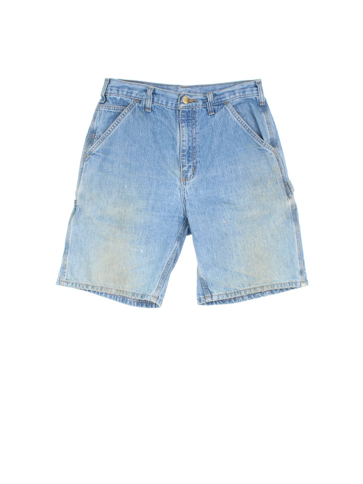 Vintage Carhartt Denim Carpenter Shorts in blue colourway with multiple pockets and leather logo embroidered on the back.