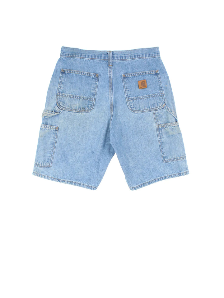 Vintage Carhartt Denim Carpenter Shorts in blue colourway with multiple pockets and leather logo embroidered on the back.