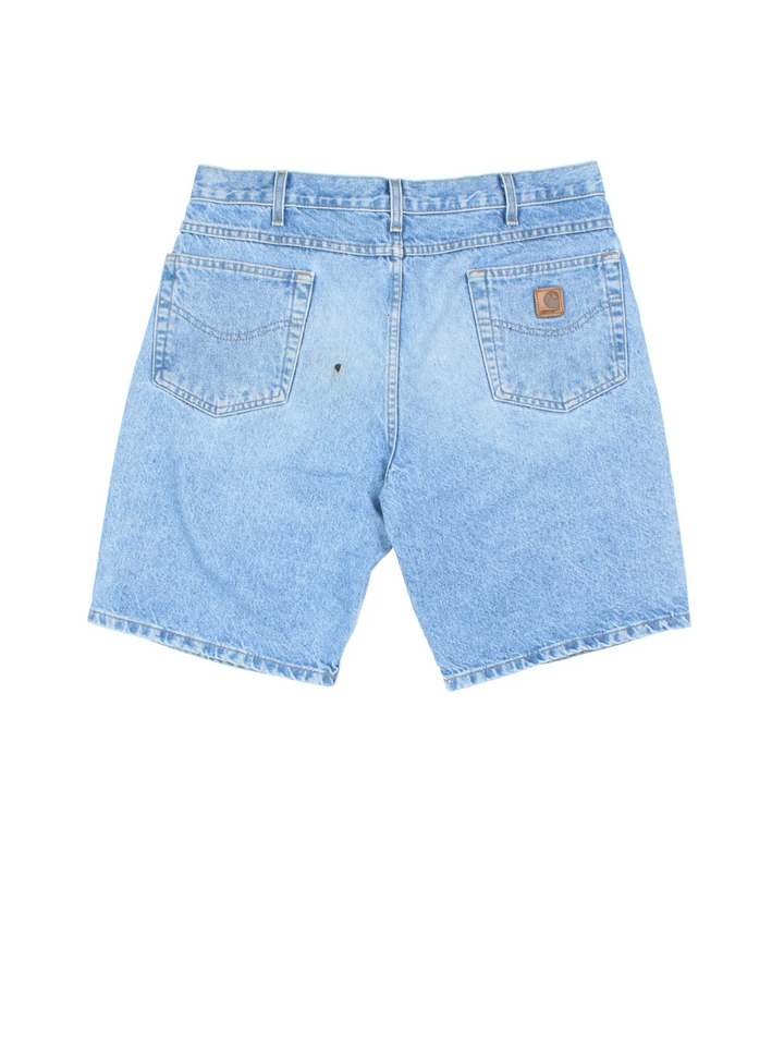Vintage Carhartt shorts in blue colourway with multiple pockets and leather logo embroidered on the back.