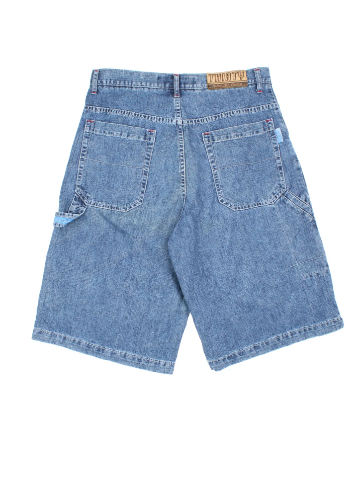 Vintage Denim Shorts in blue colourway. Zip fly fastening, multiple pockets and branding embroidered on back.