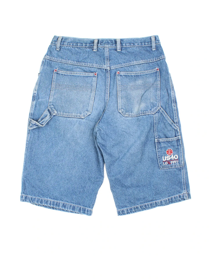 Y2K Denim Jorts in blue colourway with multiple pockets and the logo embroidered on the back.