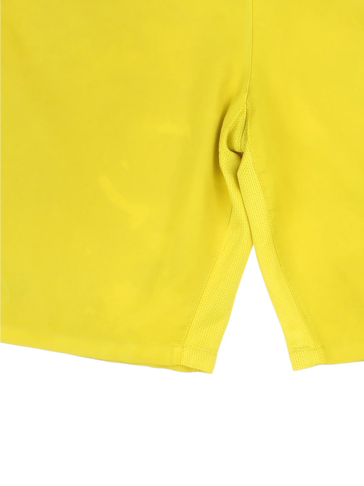2012/13 Barcelona Nike Away Football Shorts in yellow colourway with multiple pockets, contrast piping and the logo embroidered on the front/back.