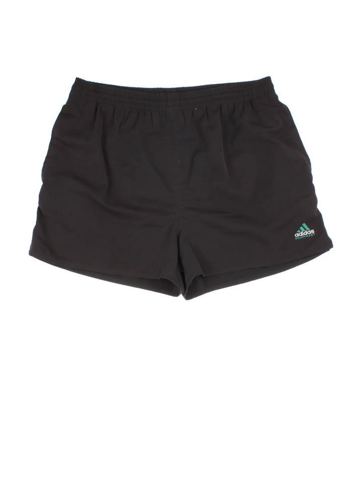 Vintage 90's Adidas Equipment Shorts in black colourway. Drawstring waist, multiple pockets and the logo embroidered on the front.
