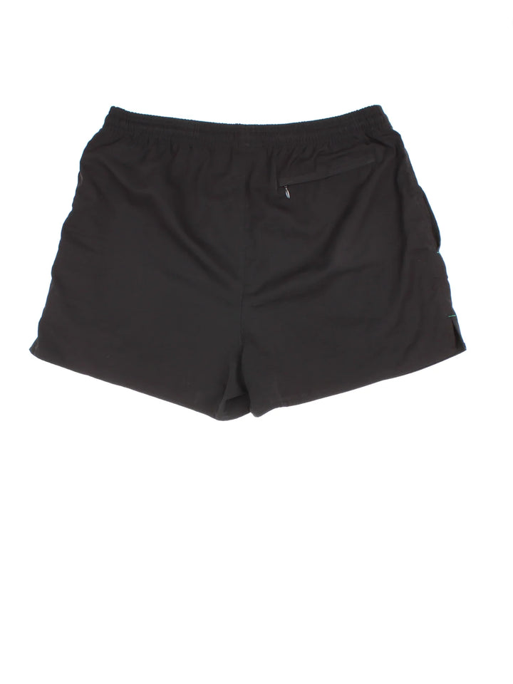 Vintage 90's Adidas Equipment Shorts in black colourway. Drawstring waist, multiple pockets and the logo embroidered on the front.