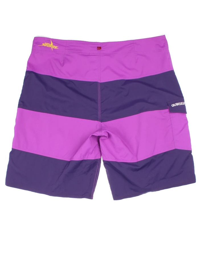 Quicksilver Melbourne Storm Swim shorts in purple colourway with lace up fastening, side pocket and the logo embroidered on the front/back.