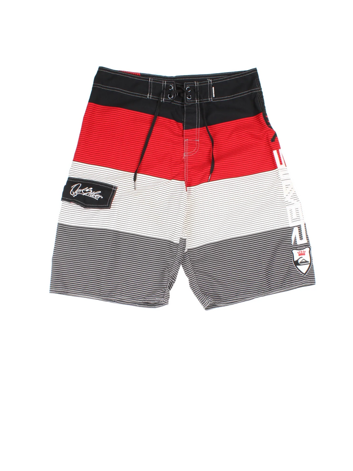 Quicksilver Board shorts in red/grey colourway with lace up fastening, side pocket and the logo embroidered on the front.