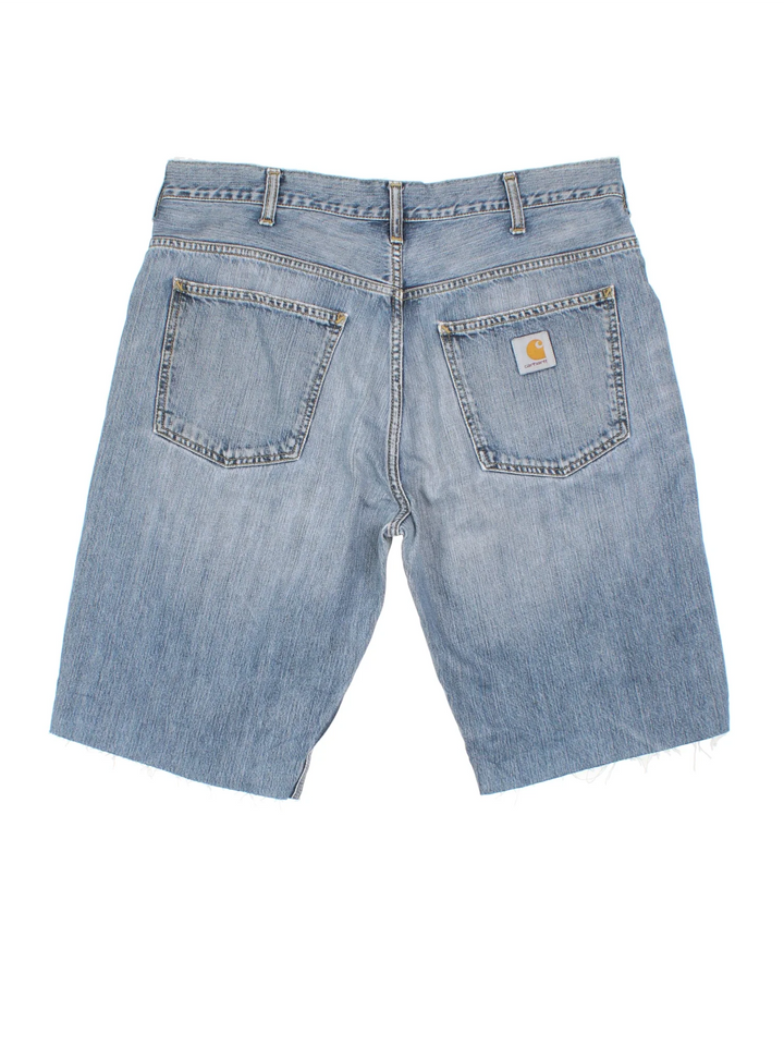 Carhartt Cut Off Shorts in blue colourway. Zip fly fastening with multiple pockets, frayed hem and embroidered branding on the back.
