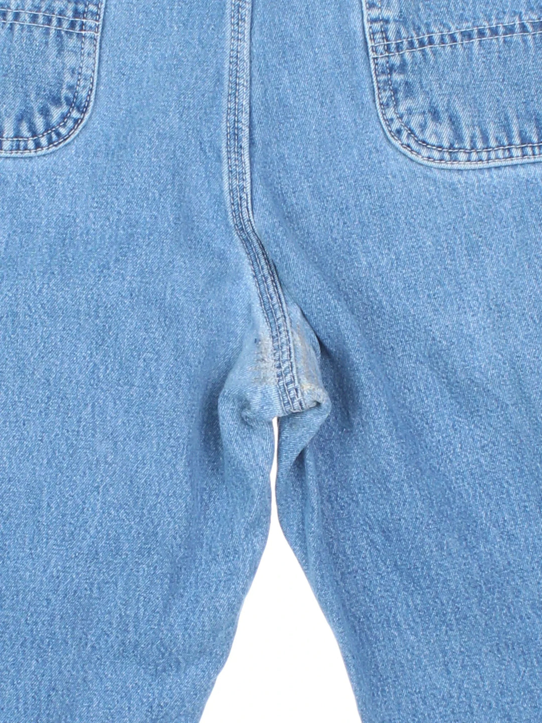 Carhartt Cut Off Shorts in blue colourway. Zip fly fastening with multiple pockets, frayed hem and embroidered branding on the back.