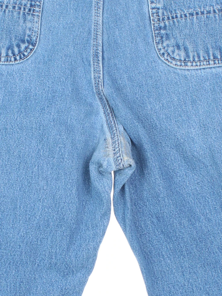 Carhartt Cut Off Shorts in blue colourway. Zip fly fastening with multiple pockets, frayed hem and embroidered branding on the back.
