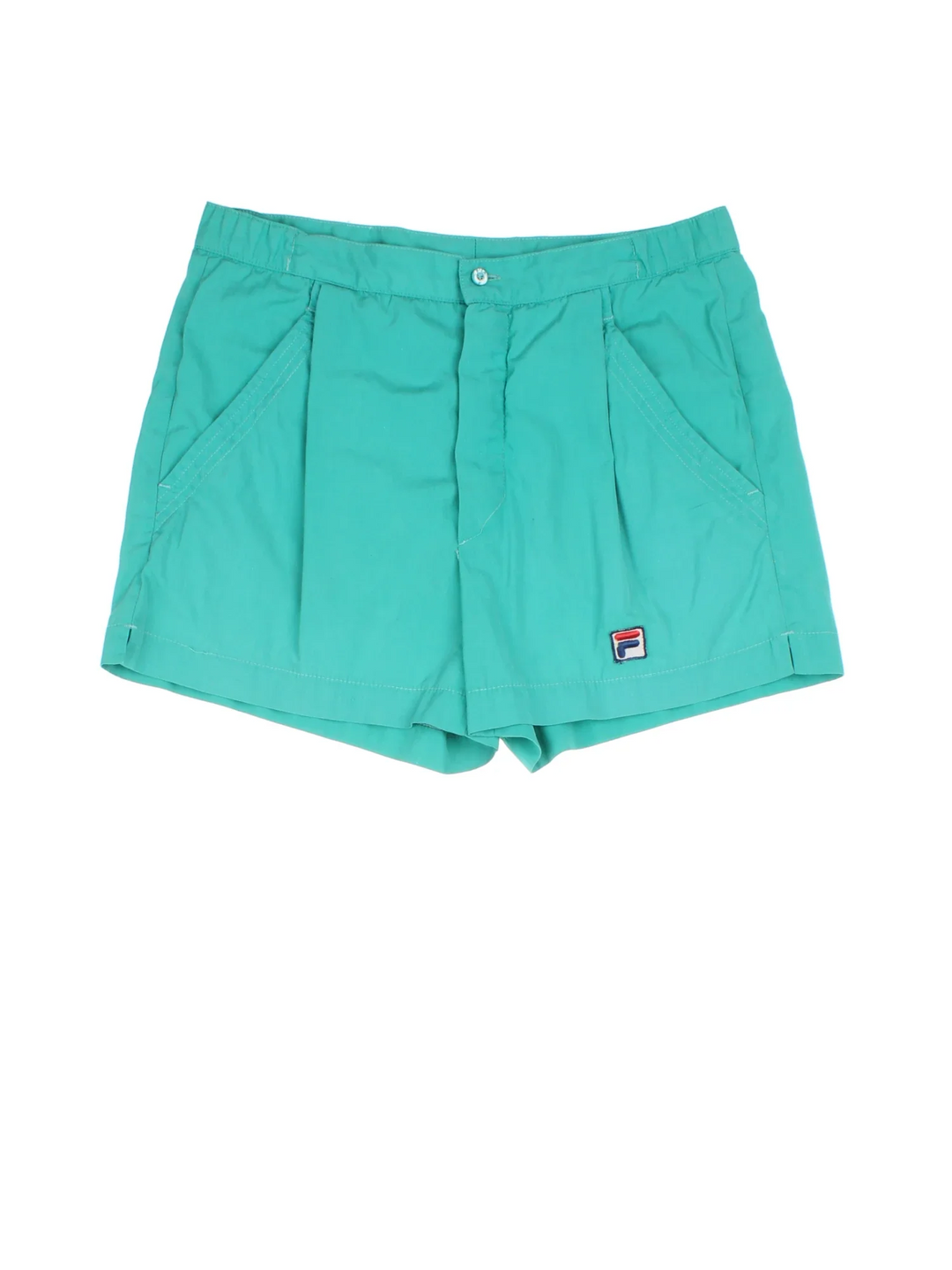 Vintage Fila Tennis Shorts in blue colourway with pockets, pleated and the logo embroidered on the front.
