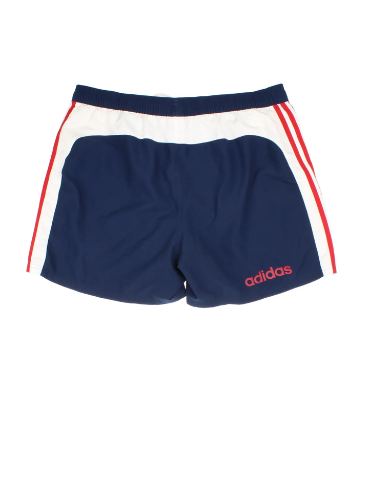 Adidas Swim Shorts in blue, red and white colourway with pockets, elasticated waist with drawstring, mesh lining and the logo printed on the back.