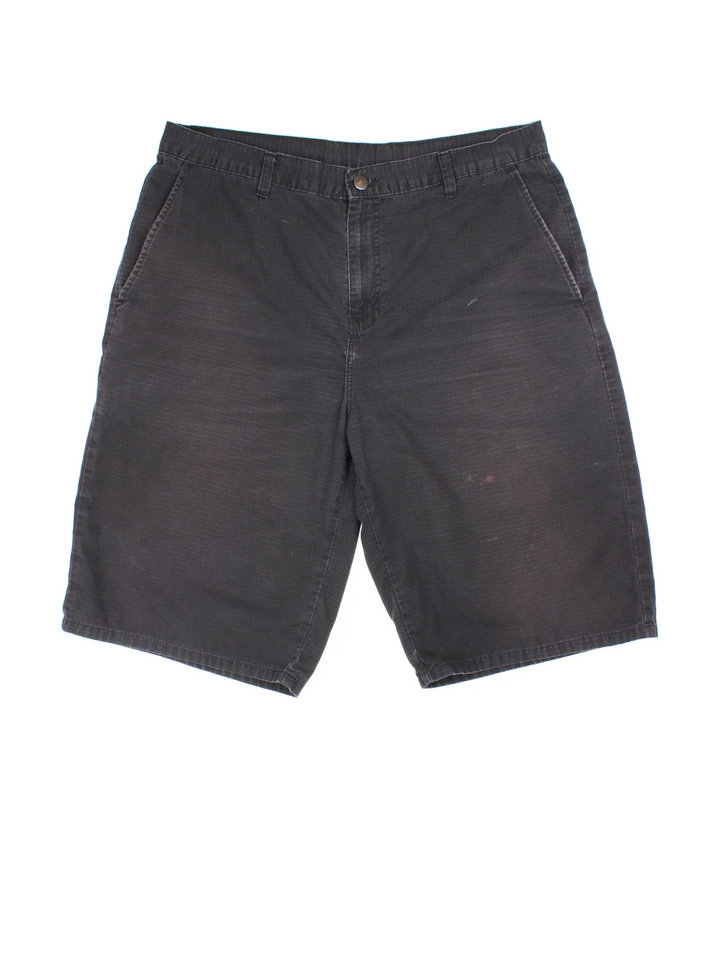 Vintage Dickies shorts in black colourway with multiple pockets and the logo embroidered on the back.