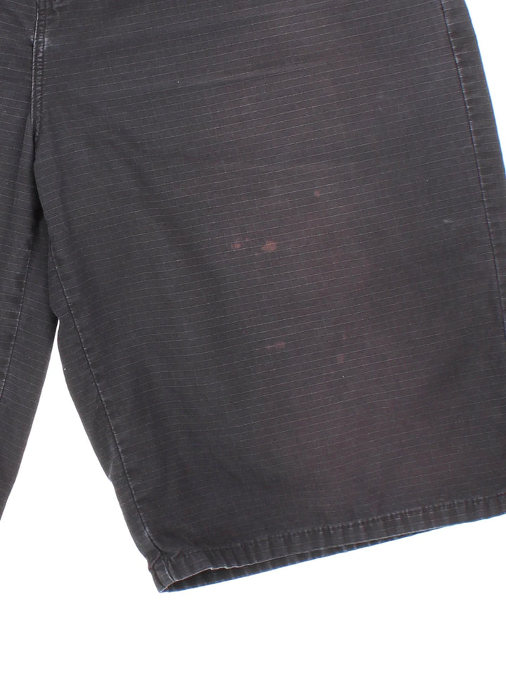 Vintage Dickies shorts in black colourway with multiple pockets and the logo embroidered on the back.