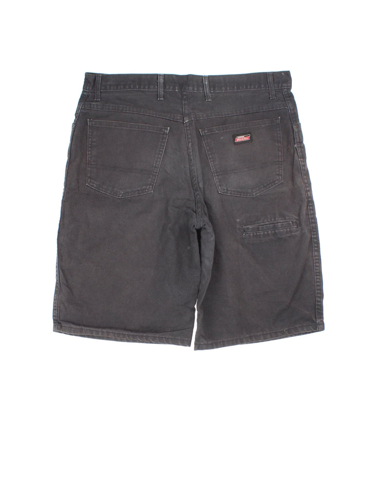 Vintage Dickies shorts in black colourway with multiple pockets and the logo embroidered on the front.