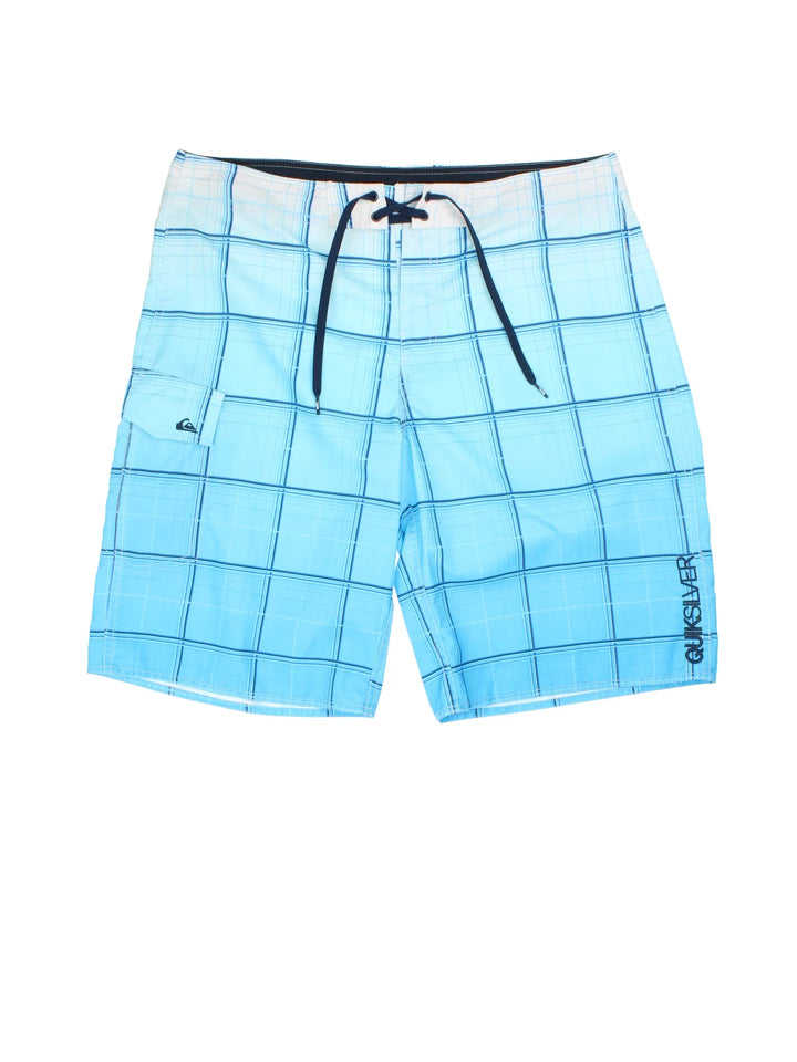 Vintage Quicksilver Board Shorts in blue/white colourway with tie waist, all over print and the logo embroidered on the front/back.