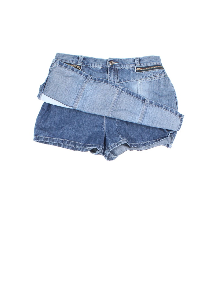 Y2K Denim Skort in blue colourway. Front zip/button fastening, with multiple pockets and built in shorts underneath.