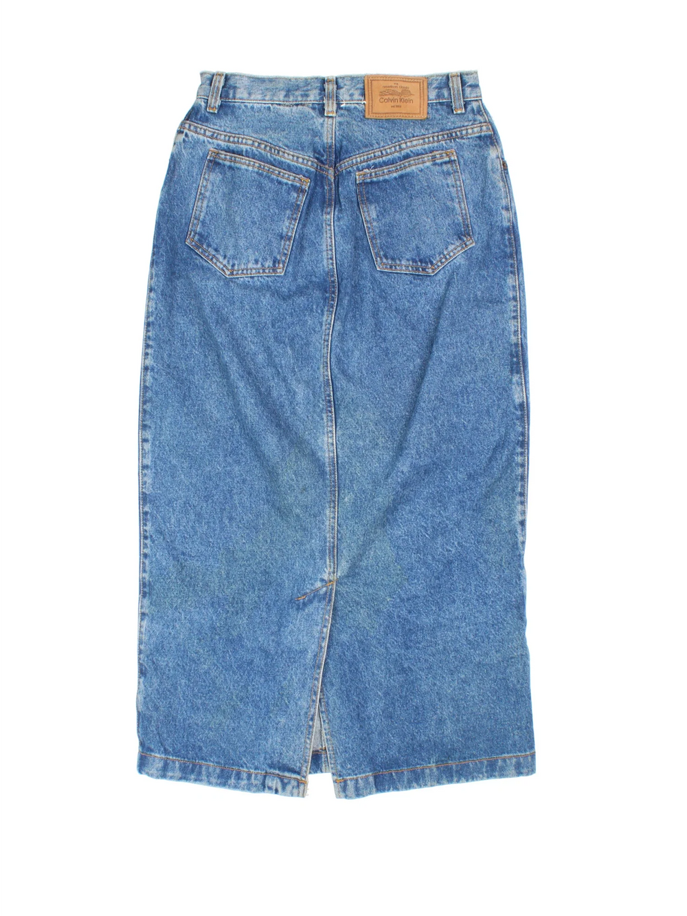 90's Calvin Klein Denim Maxi Skirt in blue colourway. Front zip fastening, with side pockets and leather patch branding.