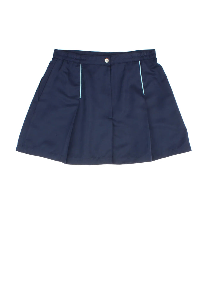 Ellesse Tennis Skirt in blue colourway. Front zip fastening, with contrast pleate detail and embroidered branding.