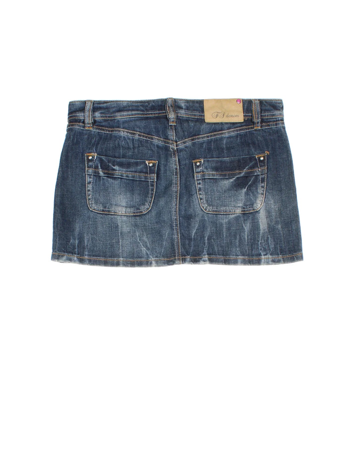 Y2K Denim Mini Skirt in blue colourway with zip fly waist, multiple pockets and contrast stitching.
