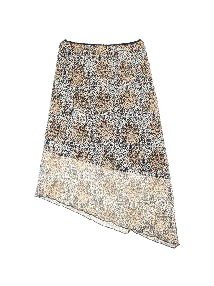 Y2K Leopard Print Asymmetrical Skirt in tan colourway with all over print and sheer overlay.