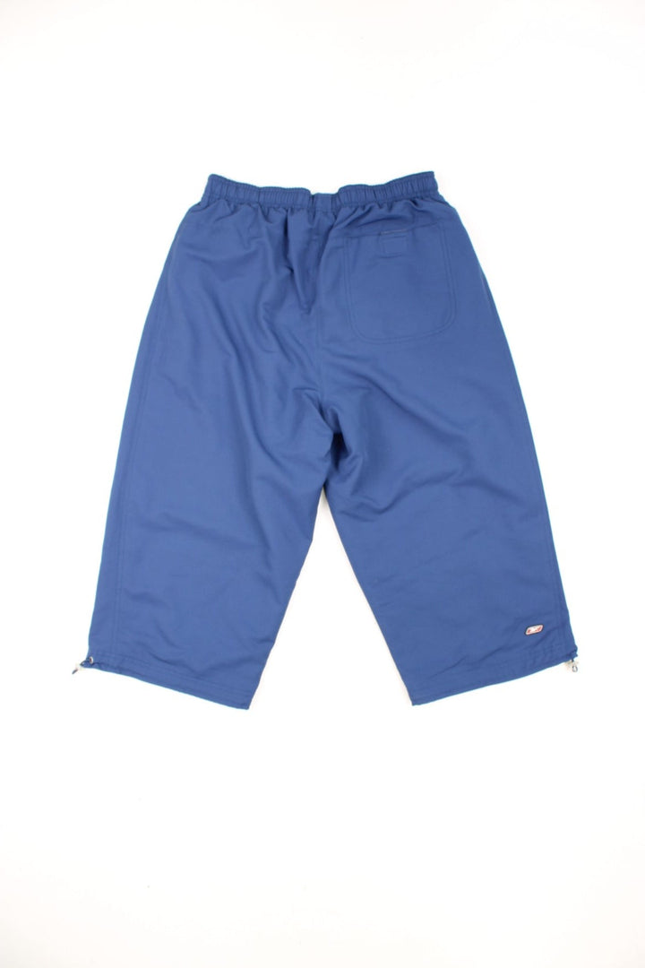 Vintage Reebok capri shorts with elasticated drawstring waist and puff print logo on the leg. 