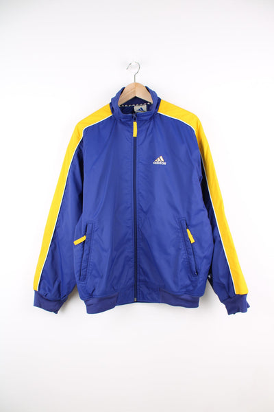 Vintage Adidas bomber style jacket in blue and yellow. Features embroidered logo on the chest.