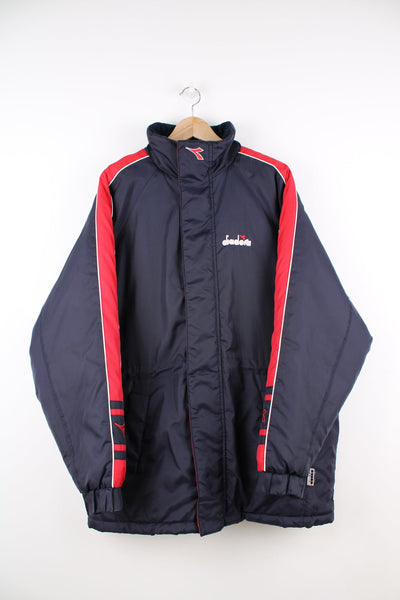 Vintage blue and red Diadora coat featuring embroidered logo on the front and back.