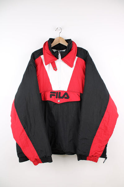 Vintage Fila pullover coat in black, red and white with half zip and pouch pocket. Features embroidered logo on the front and back.