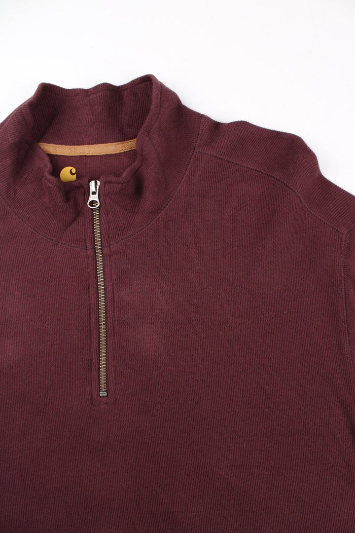Carhartt 1/4 Zip Sweatshirt in a red colourway with small logo on the hem.