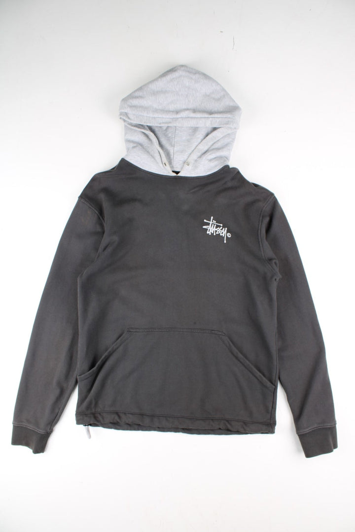 Stussy Two Tone Sweatshirt in a grey colourway with pocket and small logo on the front. Large Stussy logo on the back.